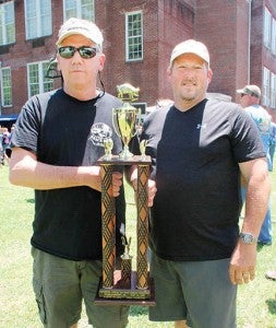 Steve Sumner (left) and Chris Fineran – aka Beach Boys BBQ – display the first place trophy they won as the top cooking team at Saturday’s 15th annual Roanoke-Chowan Pork Fest in Murfreesboro. | Staff Photo by Cal Bryant