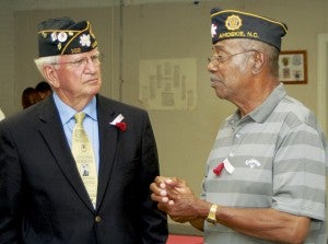 American Legion Post 102 Commander James Hutchinson (left) chats with local military veteran James Britt following the Ahoskie Memorial Day service. Staff Photo by Gene Motley