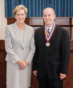 Susan Klutzz, Secretary of the North Carolina Department of Cultural Resources, presented Jones with his medallion for volunteer service.