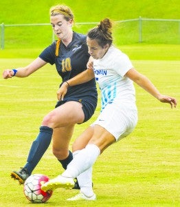 Chowan’s Harriett Pallet (right) battles a Goldey-Beacom defender in Thursday’s match in Murfreesboro.  The Hawks scored first, but lost a heartbreaker, 2-1, in double overtime. | Photo by Angie Todd