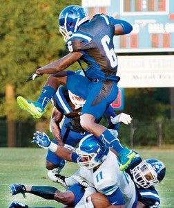 The Chowan University defense swarms to football to bring down West Florida receiver Ishmel Morrow in Saturday’s non-conference game at James G. Garrison Stadium. | Photo by Angie Todd