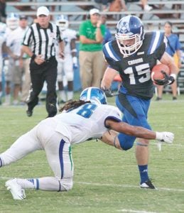 Chowan receiver Nolan Ryan (#15) uses a straight arm on a defender as he fights for extra yardage in a recent game. This past Saturday in Salisbury, Ryan had a game-high 135 receiving yards and a touchdown as the Hawks defeated Livingstone College, 41-13. | Staff Photo by Cal Bryant