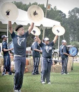 The Bertie High Falcon Regiment is shown performing with symbols as part of their routine during the Peanut Festival’s opening ceremony. 