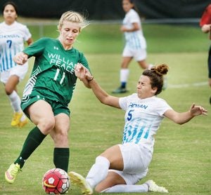 Harriett Pallet (#5), a midfielder for the Chowan University women’s soccer team, slides in front of Amber Arnold of William Peace College when the two schools met on Wednesday.